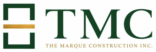 TMC monogram with green emblem and gold bar