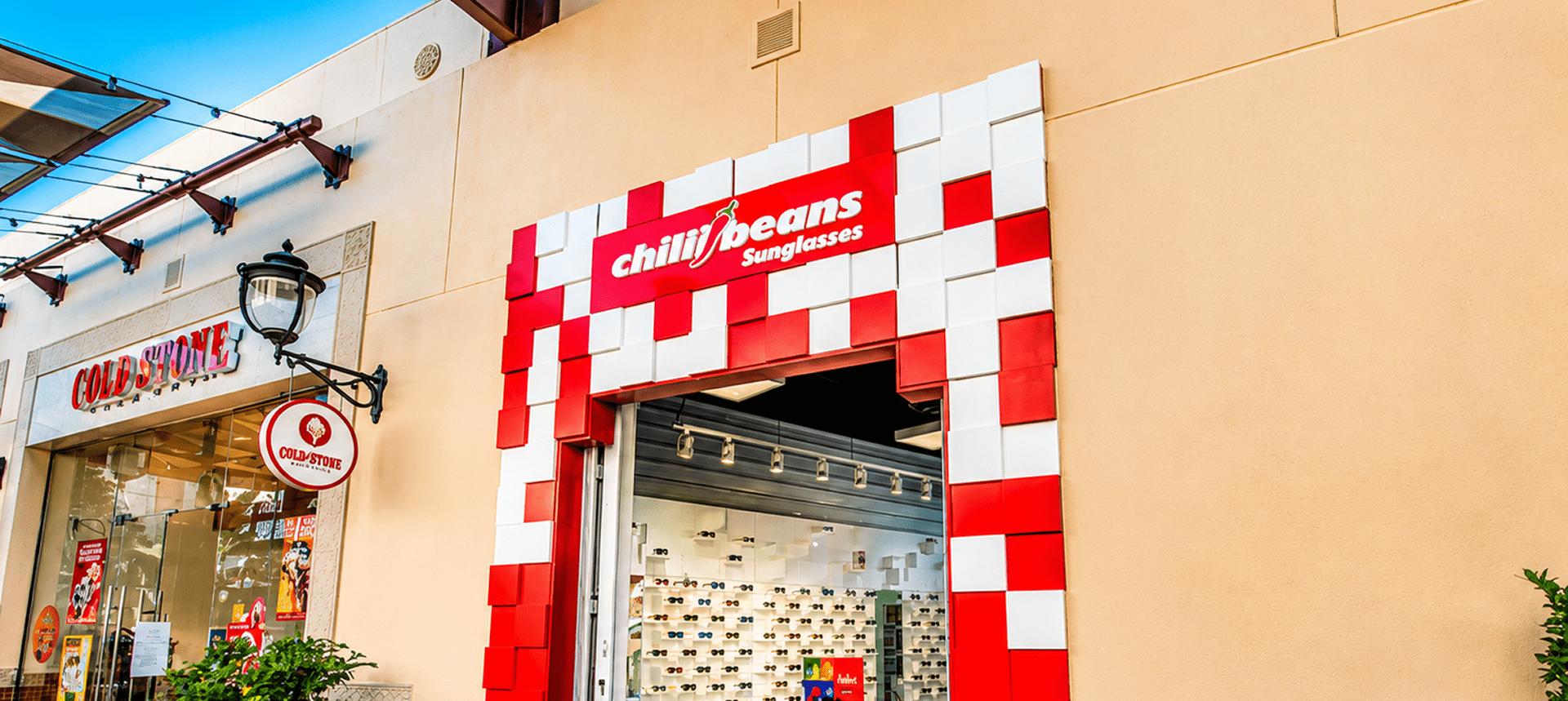 Sunglasses store with red and white facade.