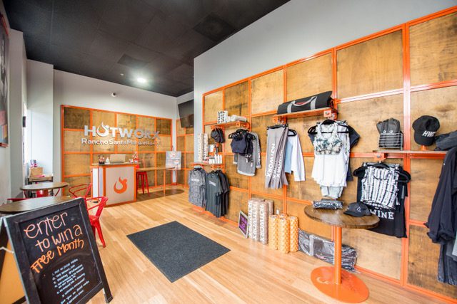 Fitness studio lobby with merchandise display wall.