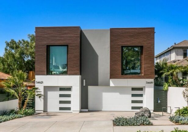 Modern two-story house with two garages.
