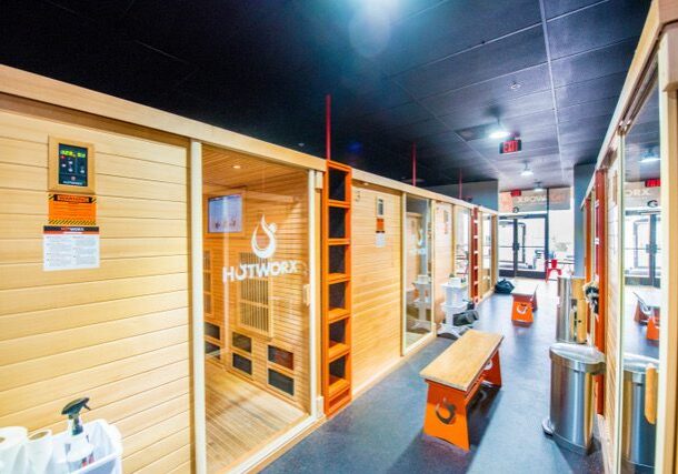 Sauna interior with wooden benches and decor.
