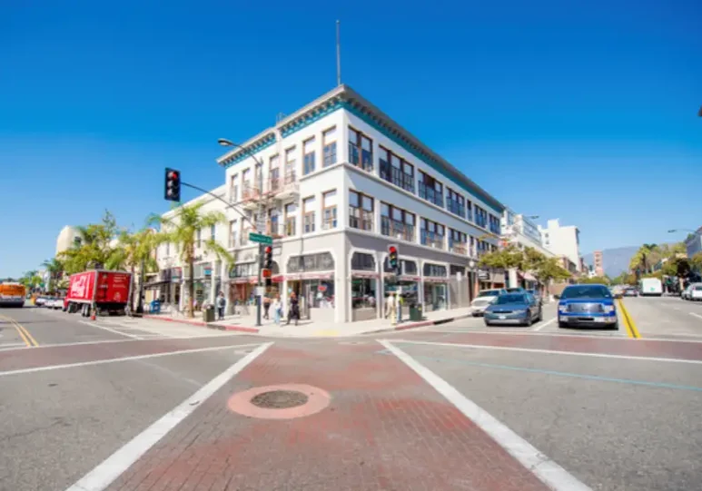 Street intersection with historic corner building.