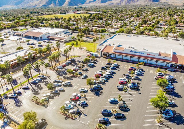 Aerial view of supermarket and parking lot.