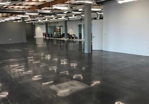 Open industrial space with polished concrete floor.